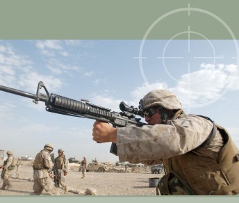United States Marine firing an M16A4 with ACOG attachment. M16A4 with ACOG attachment will fit in a Combat Weapons Rack without removing the scope on the M16.