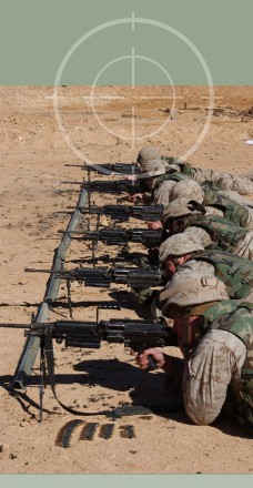 United States Marines firing M249 SAW during training excercises for Operation Iraqi Freedom. M-249 SAWs can be stored in Combat Weapons Racks with the bi-pod attached to the weapon.